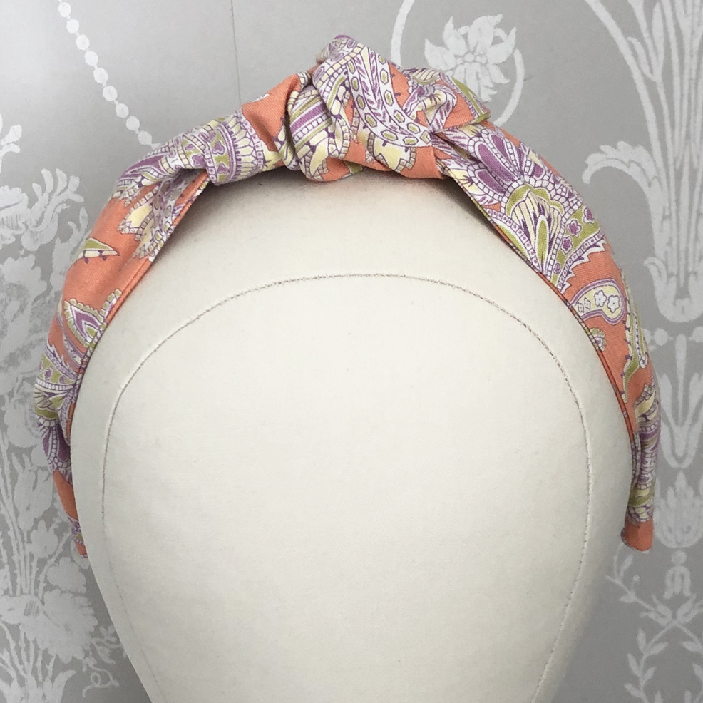 Knotted Headband Orange Print on head
